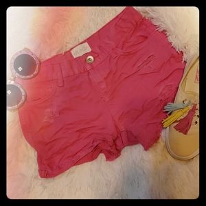 Pink distressed denim shorts